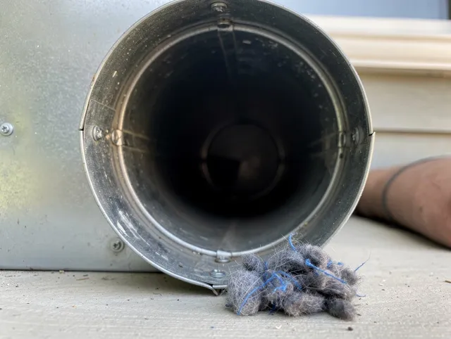 Huntington Park Dryer Vent Cleaning technician using specialized equipment to clear severe dryer vent blockage in Huntington Park
